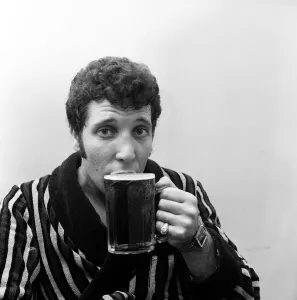 Singer Tom Jones drinking a pint of beer at Cesars Palace Nightclub