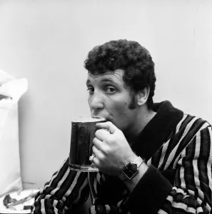 Singer Tom Jones drinking a pint of beer at Cesars Palace Nightclub