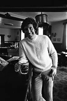 01234 Prints: Singer Tom Jones has a quiet drink at his local in Weybridge after missing fans