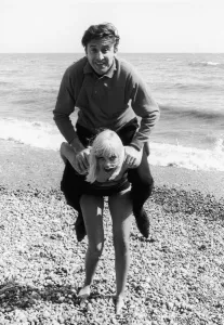 Man And Woman Prints: Singer Vince Hill seen here playing on the beach at Brighton with TV presenter Anne