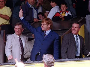 Singer and Watford Chairman Elton John acknowledge the standing ovation from the fans as
