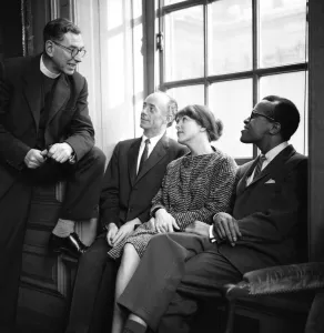 Men And Woman Prints: Singers Dave Lambert, Jon Hendricks and Annie Ross talking to Reverend Collins