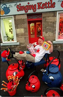 Singing Kettle Artie Trezise January 1998 outside shop home offices of Singing