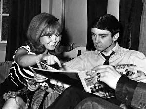 Magazine Prints: Singing stars Lulu and Gene Pitney relax during an interval between shows at the Capitol