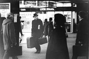 Platform Prints: Sir Alec Douglas Home looking vague at railway station carrying luggage - February 1979