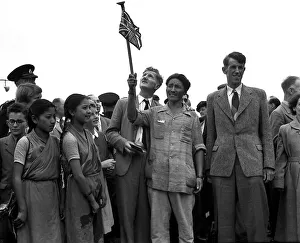 Sir Edmund P Hillary (tall man on the right in suit)- Conquers Mount Everest - Jul 1953