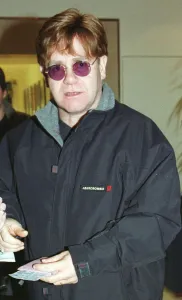 Knighthood Prints: Sir Elton John December 1999 leaves Heathrow Airport for Los Angeles