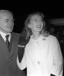 Sir Frank Whittle assisted by Janet Scott christen the first TWA jet aircraft to leave