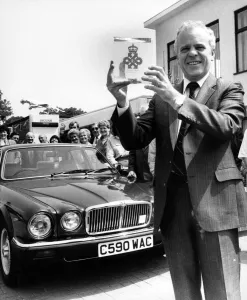 Pride Prints: Sir John Egan shows the Queens Award for Export Achievement presented to him today by