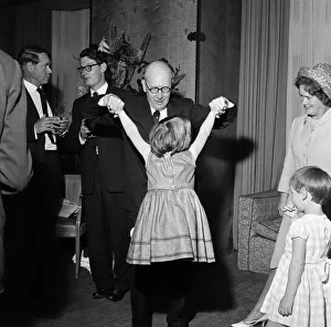 Sir John Wolfenden playing with 6 year old Belinda Agard at The Savoy