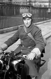 00019 Prints: Sir R Ackianl seen here on his motor cycle. January 1936 OL304C