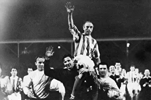 Sir Stanley Matthews is carried from the pitch in celebration following his testimonial