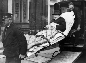 Illness Prints: Sir Winston Churchill 1954 being stretchered off ambulance, smoking cigar
