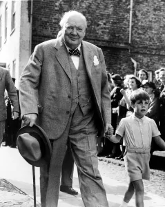 Sir Winston Churchill arrives at Westerham church with his grandson Nicholas for