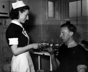 00096 Prints: Sister Anne Davies of the Port Medical Service in Dents Wharf