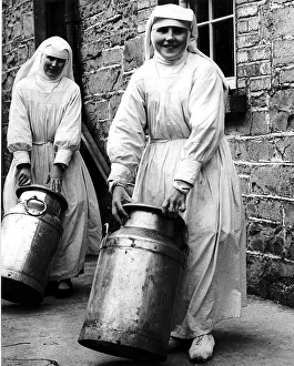 Dairy Prints: Sister Mona and Sister Benignus of Loughglynne Convent roll in the churns of milk