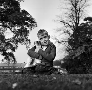 Six-year-old Richard Brown with his miniature white Poodle Dewdrop