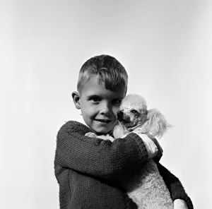 Six-year-old Richard Brown with his miniature white Poodle Dewdrop