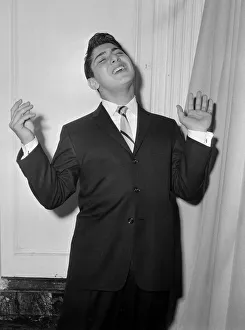 Sixteen year old Canadian singer songwriter Paul Anka pictured on his arrival in Britain