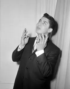 Sixteen year old Canadian singer songwriter Paul Anka pictured on his arrival in Britain