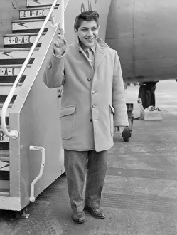 Sixteen year old Canadian singer songwriter Paul Anka pictured on his arrival in Britain