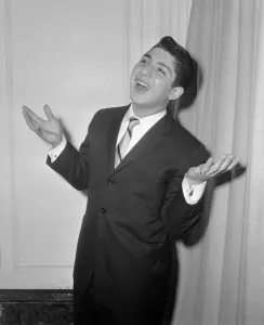 Sixteen year old Canadian singer songwriter Paul Anka pictured on his arrival in Britain