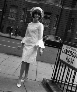 Sixties Fashion by Kiki Byrne Model wearinf white dress with wide sleeves
