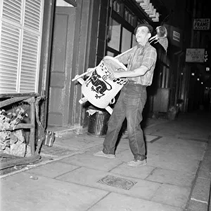 Skiffle group belived to be called the Black Cat seen here setting up in a pub before a