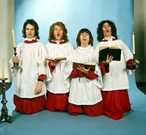 Slade dressed in choir boy outfits Christmas setting with candles