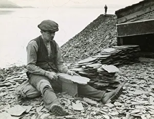 Slate production 1930s Seil Island near Oban workman splitting slates with special
