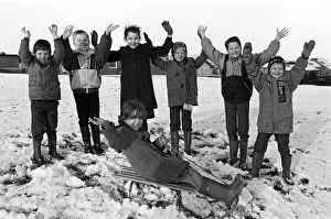 Sledge Prints: Sledging at School, Tracey Douglas is cheered on by schoolmates at Carr Green Junior