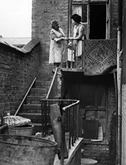 Gossip Prints: Slum housing in Birmingham. Mrs B Roach and daughter Ann Roach of Gladstone Road