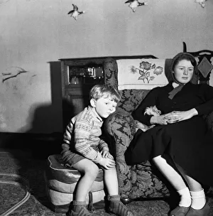Boredom Prints: A small boy watches television. 12th March 1954 Howard is four