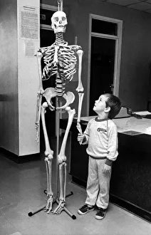 Death Prints: A small child holding hands with a skeleton on 10th September 1985