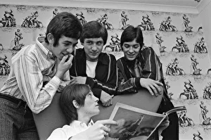 The Small Faces pop group pictured in a provincial hotel room as they watch their latest