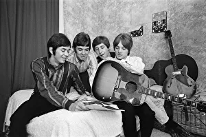 00807 Prints: The Small Faces pop group pictured in a provincial hotel room as they watch their latest