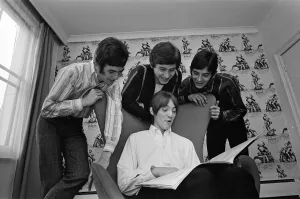 The Small Faces pop group pictured in a provincial hotel room as they watch their latest