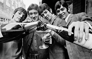 The Small Faces go to the Top of the Pops chart. OPS Celebrating with champagne L-R Steve