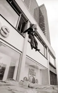 With a smile on her face stunt girl Sue Crosland plunges 30ft from a window in the Thames