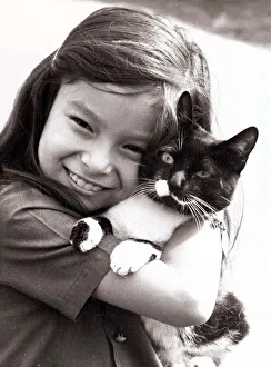 00134 Prints: Smiling Carol Riley of Ealing collects her pet cat Cupid after he was released