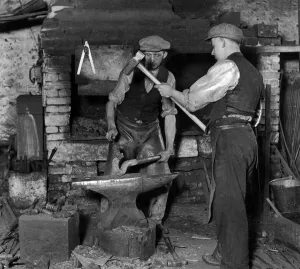 Smiths at work in the 100-year-old blacksmiths shop owned by James Luke