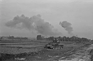 Smoke Prints: Smoke rising in the distance as armoured units of the South Vietnamese army shell Viet