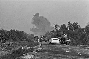 01268 Prints: Smoke rising in the distance as armoured units of the South Vietnamese army shell Viet
