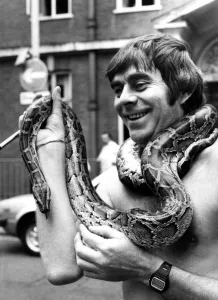 Reptiles Prints: Snake man Charms Court. Busker Denis Carthy was let off a fine on Monday August 23 after