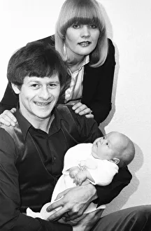 00329 Prints: Snooker player Alex Hurricane Higgins with his baby daughter Lauren
