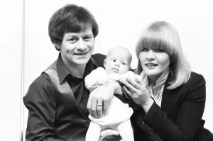 00329 Prints: Snooker player Alex Hurricane Higgins with his baby daughter Lauren