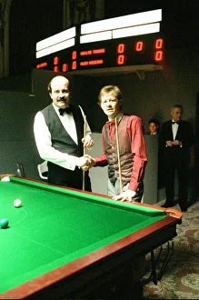 Shaking Hands Prints: Snooker player Alex Hurricane Higgins with his foot in plaster