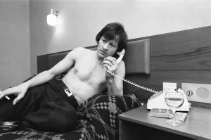 00329 Prints: Snooker player Alex Hurricane Higgins relaxing with a drink
