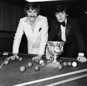 00677 Prints: Snooker player Jimmy White pictured receiving a trophy from Cliff Thorburn at Kingston