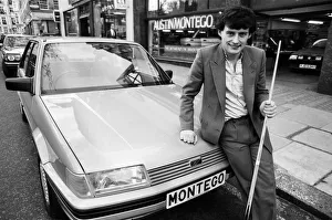 00677 Prints: Snooker player Jimmy White poses beside a new model Austin Montego. 11th May 1984